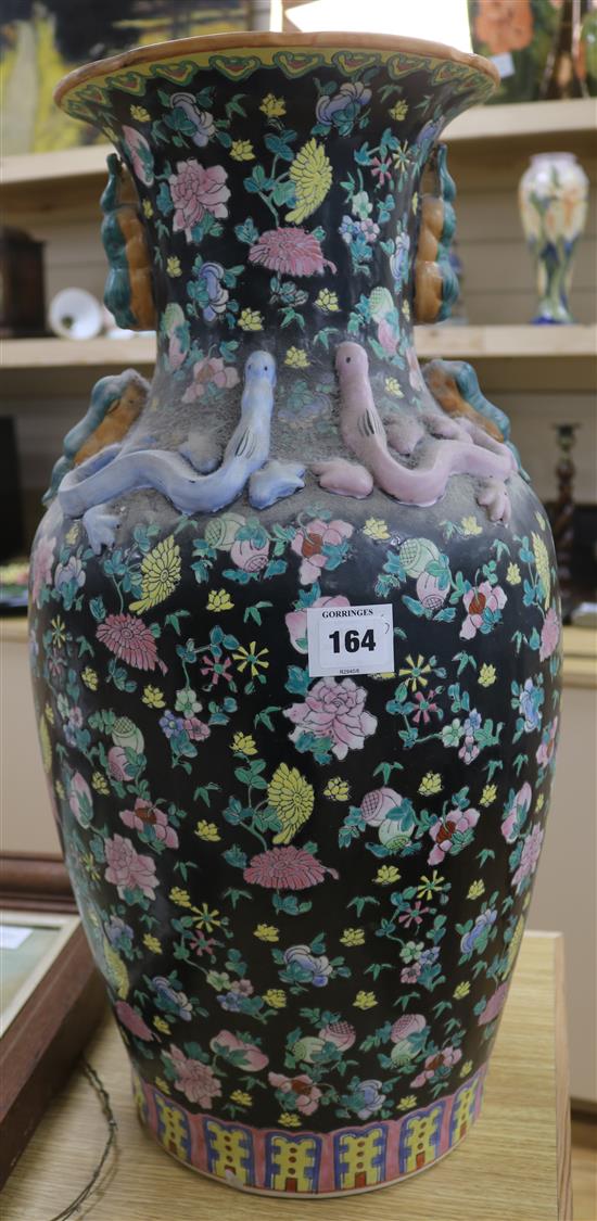 A large Chinese famille noire vase